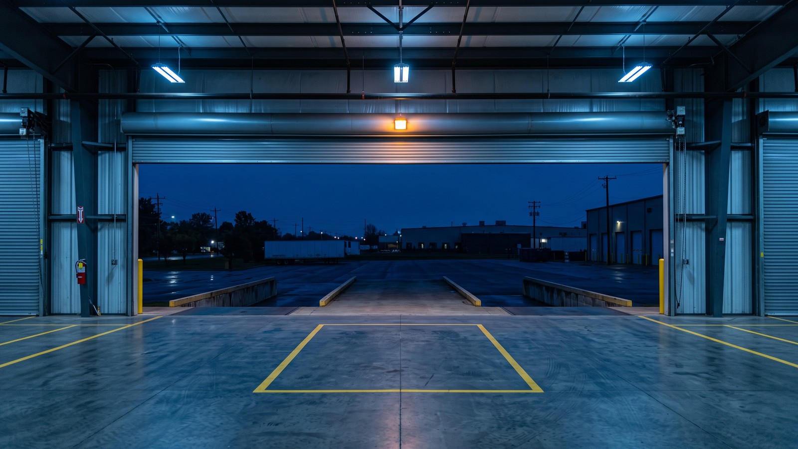 Empty equipment bay at dusk representing end-of-term lease return or buyout decision
