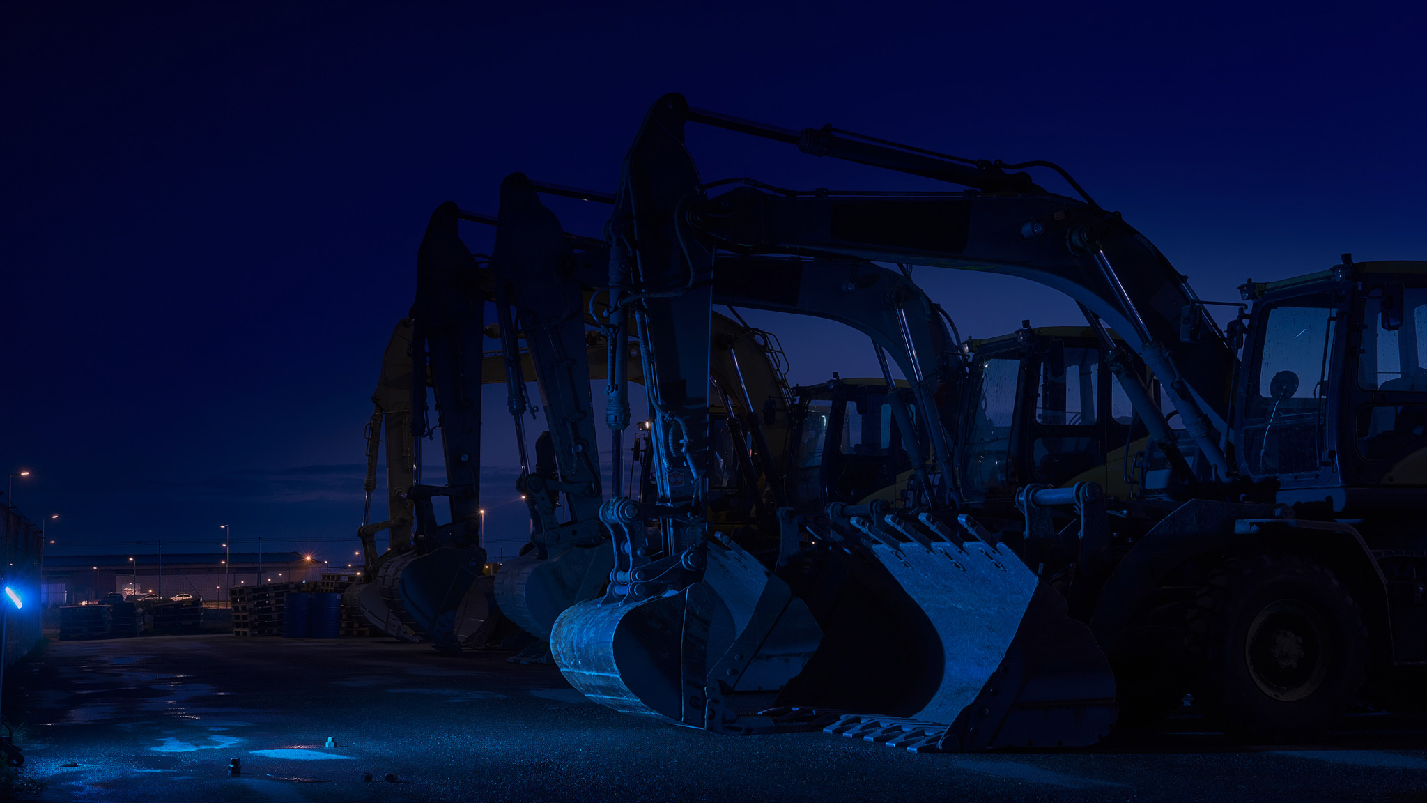 Heavy equipment silhouetted at blue hour, representing the equipment financing and Section 179 tax planning context